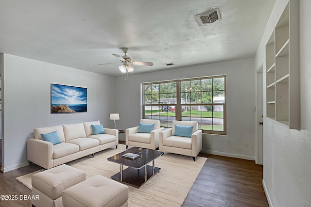 607 Marlene Dr, Holly Hill, FL 32117 - living area with wood finished floors and ceiling fan