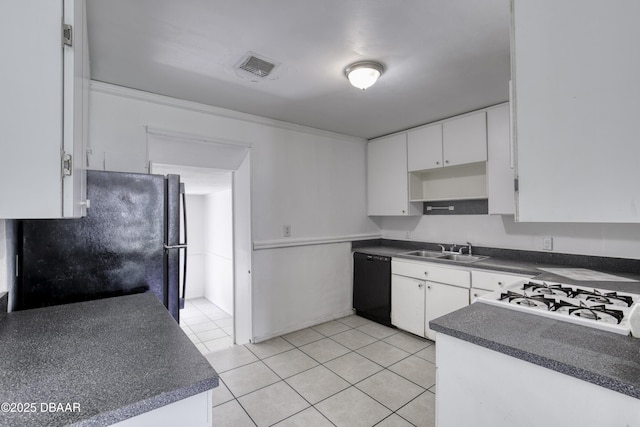 607 Marlene Dr, Holly Hill, FL 32117 - kitchen featuring black appliances, dark countertops, light tile patterned flooring, and white cabinets