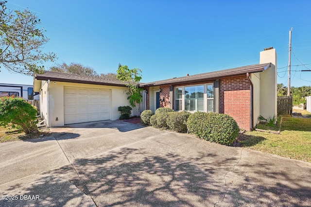 ranch-style home featuring a garage