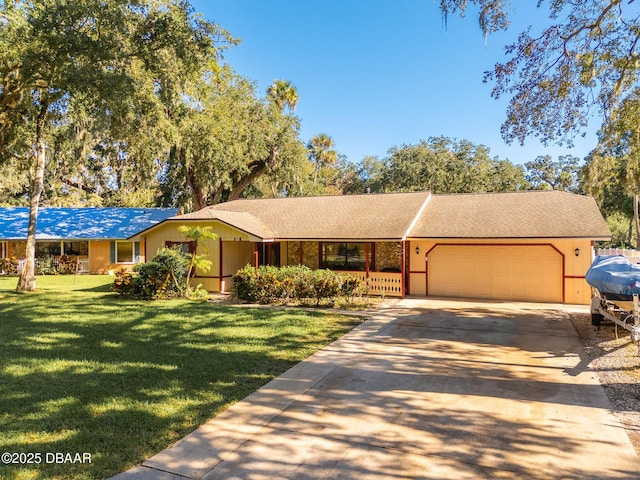 894 Quarters Ct, Port Orange, FL 32129 - ranch-style house featuring a garage, concrete driveway, and a front yard