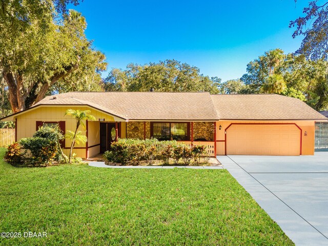 894 Quarters Ct, Port Orange, FL 32129 - ranch-style house featuring a garage, driveway, and a front lawn