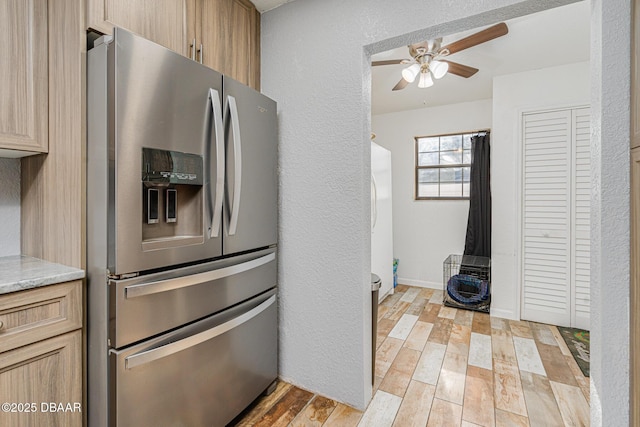 894 Quarters Ct, Port Orange, FL 32129 - kitchen with stainless steel fridge with ice dispenser, a ceiling fan, light wood-style flooring, light countertops, and a textured wall