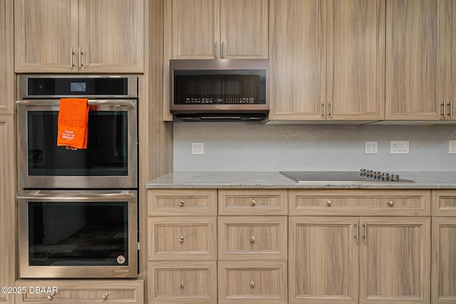 894 Quarters Ct, Port Orange, FL 32129 - kitchen with appliances with stainless steel finishes, light brown cabinetry, and light stone countertops