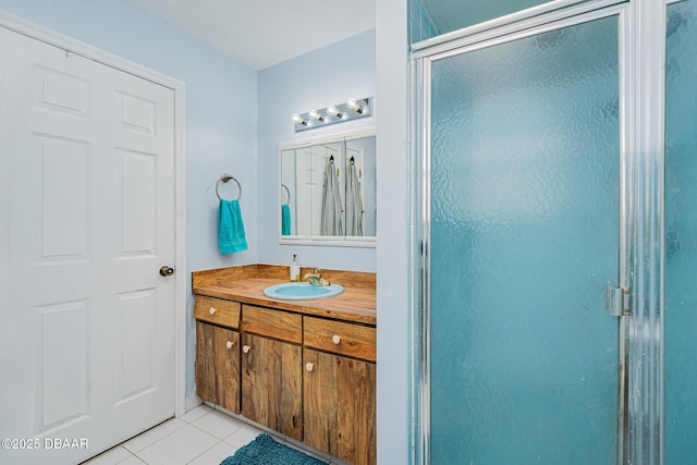 894 Quarters Ct, Port Orange, FL 32129 - bathroom featuring vanity, tile patterned floors, and a shower stall