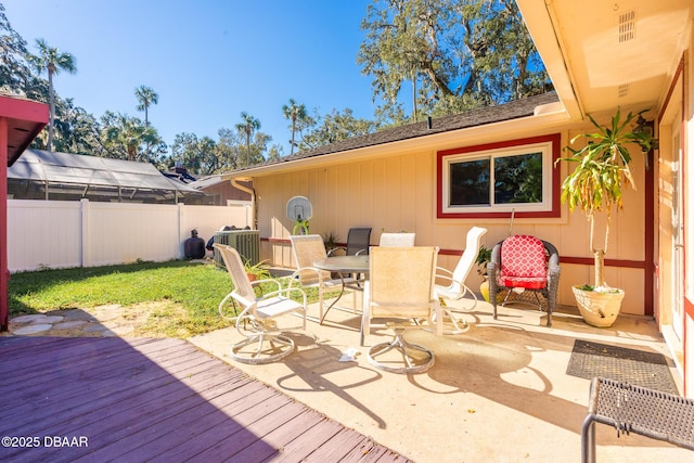 894 Quarters Ct, Port Orange, FL 32129 - wooden terrace with outdoor dining area and a patio area