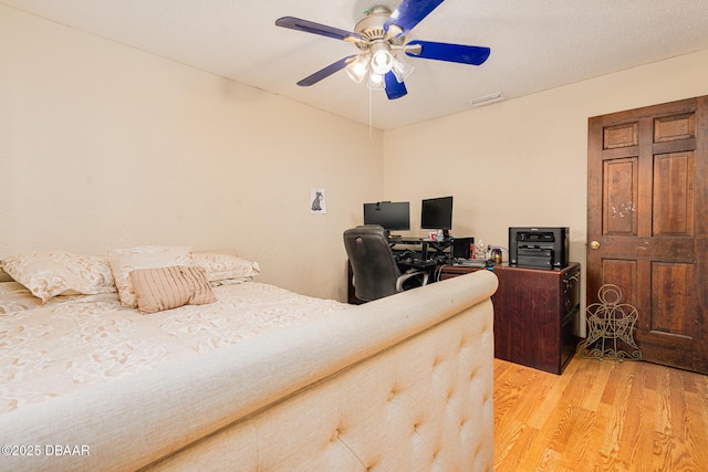 894 Quarters Ct, Port Orange, FL 32129 - bedroom with light wood finished floors and ceiling fan
