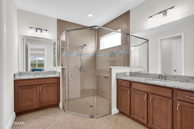 281 Compass Rose Dr, Daytona Beach, FL 32124 - bathroom with a shower stall, healthy amount of natural light, two vanities, and recessed lighting