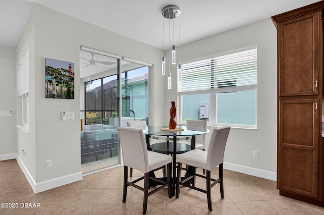 281 Compass Rose Dr, Daytona Beach, FL 32124 - dining space featuring healthy amount of natural light, baseboards, and light tile patterned floors