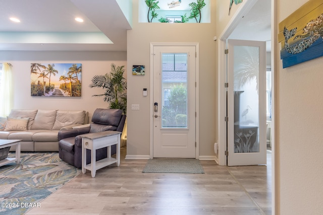 entryway with light hardwood / wood-style flooring