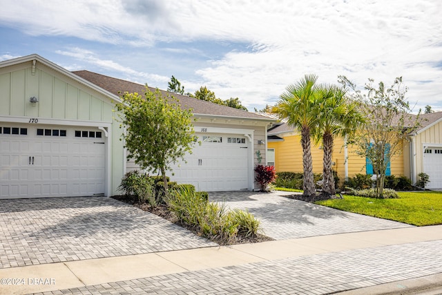 ranch-style home featuring a garage