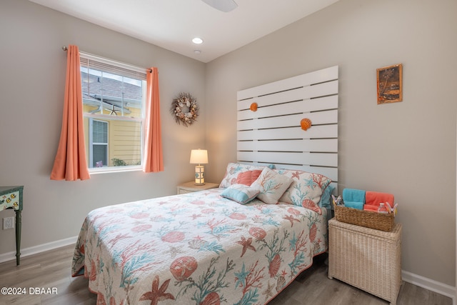 bedroom with hardwood / wood-style flooring