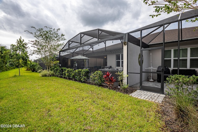 view of yard with a lanai and a patio