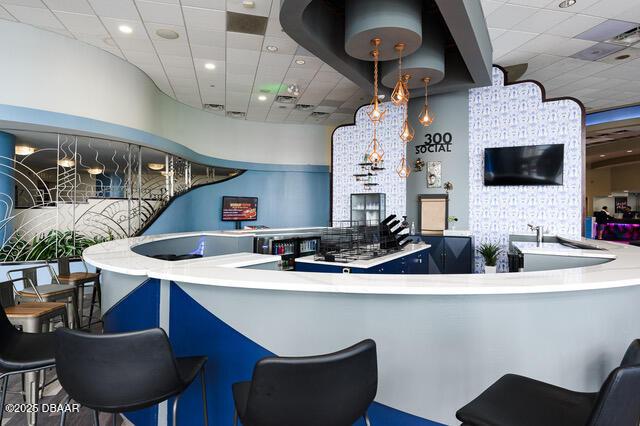 kitchen with recessed lighting and a drop ceiling