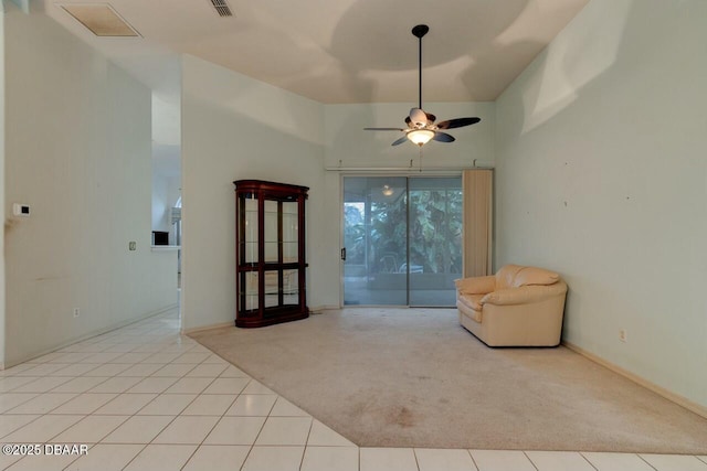 unfurnished room with light tile patterned flooring and ceiling fan