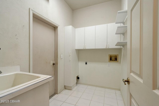 washroom featuring electric dryer hookup, hookup for a washing machine, cabinets, and light tile patterned flooring