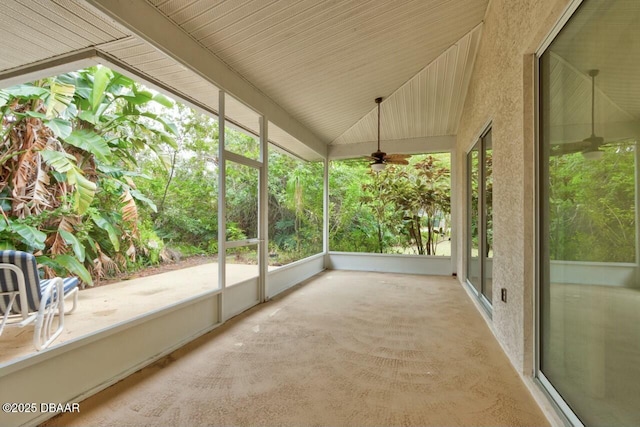 unfurnished sunroom featuring vaulted ceiling and ceiling fan