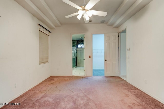 spare room featuring ceiling fan and light colored carpet