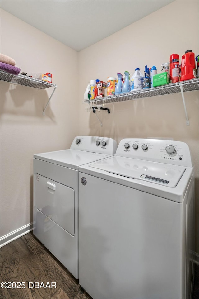 laundry room with washer and clothes dryer and dark hardwood / wood-style floors