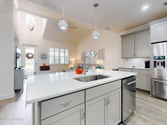 kitchen featuring ceiling fan, a sink, visible vents, stainless steel appliances, and gray cabinetry