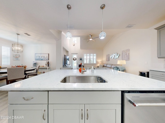 kitchen featuring visible vents, decorative light fixtures, stainless steel dishwasher, a sink, and open floor plan