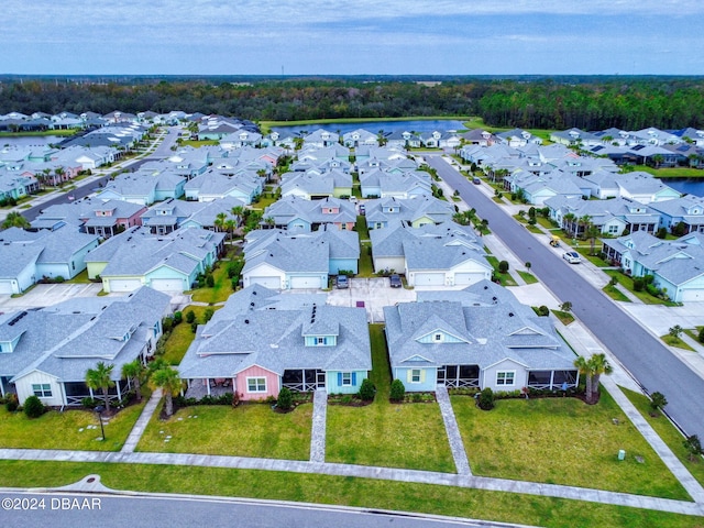 aerial view featuring a water view and a residential view