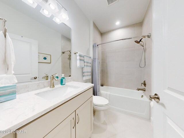 full bathroom featuring vanity, shower / tub combo with curtain, toilet, tile patterned floors, and visible vents