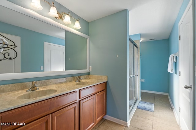 3328 Marsili Ave, New Smyrna Beach, FL 32168 - bathroom featuring double vanity, a shower stall, tile patterned floors, and a sink