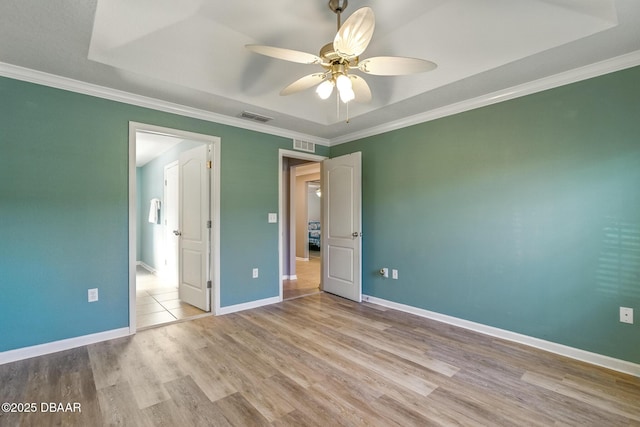 3328 Marsili Ave, New Smyrna Beach, FL 32168 - unfurnished bedroom featuring baseboards, wood finished floors, visible vents, and crown molding