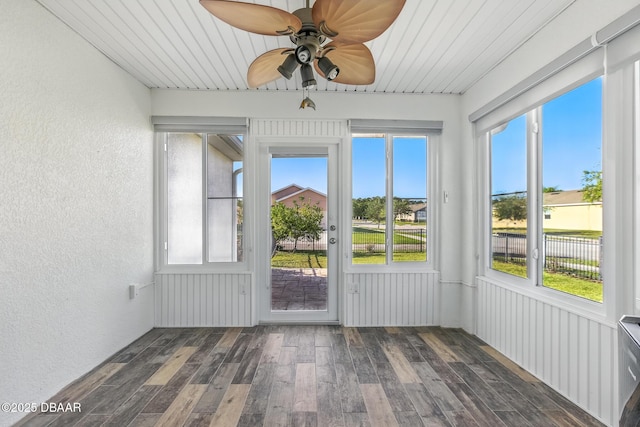 3328 Marsili Ave, New Smyrna Beach, FL 32168 - unfurnished sunroom featuring wood-type flooring, a textured wall, and ceiling fan