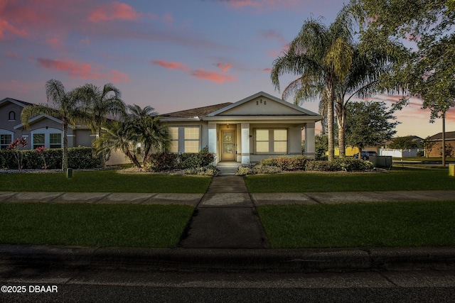 3328 Marsili Ave, New Smyrna Beach, FL 32168 - bungalow with a yard and stucco siding
