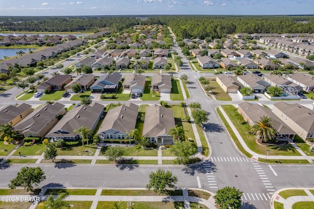 3328 Marsili Ave, New Smyrna Beach, FL 32168 - birds eye view of property featuring a residential view, a forest view, and a water view