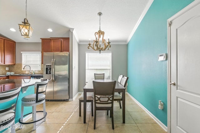 3328 Marsili Ave, New Smyrna Beach, FL 32168 - interior space featuring a notable chandelier, crown molding, light tile patterned flooring, and recessed lighting