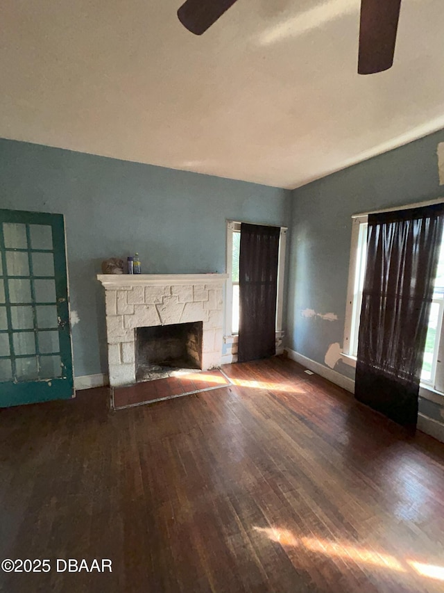 208 Bellevue Ave, Daytona Beach, FL 32114 - unfurnished living room featuring a ceiling fan, hardwood / wood-style floors, and a fireplace