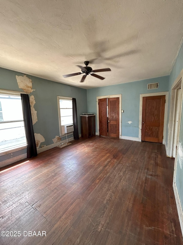 208 Bellevue Ave, Daytona Beach, FL 32114 - unfurnished bedroom featuring dark wood finished floors, a textured ceiling, ceiling fan, and cooling unit