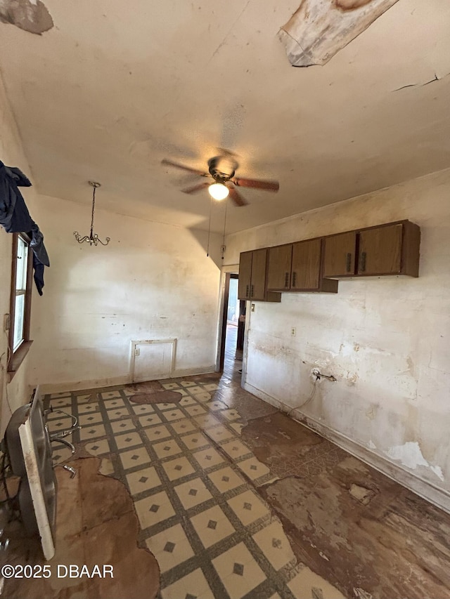 208 Bellevue Ave, Daytona Beach, FL 32114 - kitchen with ceiling fan and dark brown cabinets