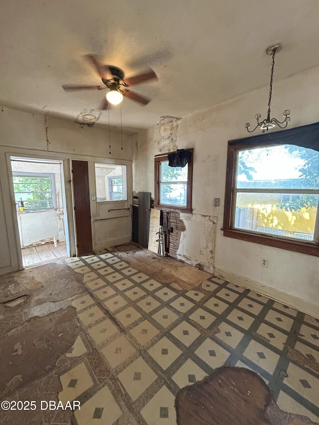 208 Bellevue Ave, Daytona Beach, FL 32114 - kitchen with ceiling fan and a chandelier