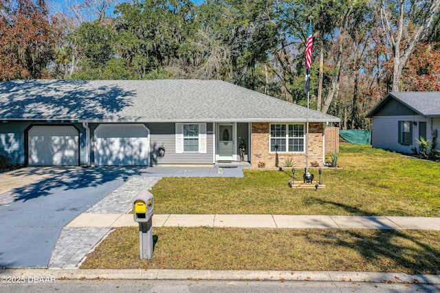 ranch-style home with a garage, covered porch, and a front yard