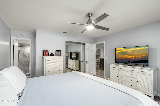 bedroom featuring connected bathroom, ceiling fan, and a closet