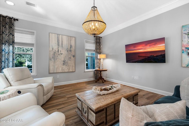 living room with ornamental molding, dark hardwood / wood-style flooring, and a notable chandelier