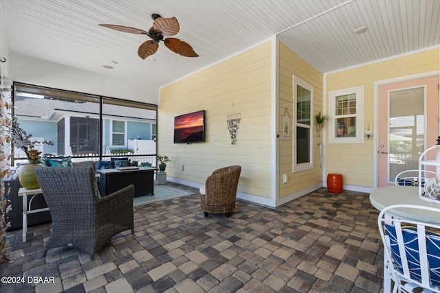 view of patio featuring ceiling fan and an outdoor living space