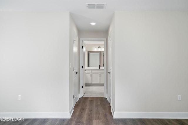 hallway with dark wood-type flooring