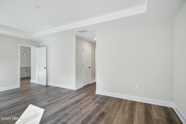 empty room with dark hardwood / wood-style floors