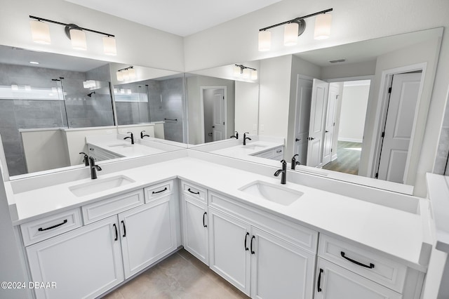 bathroom featuring vanity and a tile shower