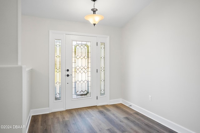 entryway with hardwood / wood-style flooring