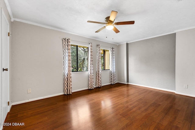 spare room with ceiling fan, dark wood-type flooring, and ornamental molding