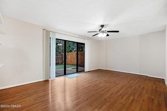 empty room featuring hardwood / wood-style flooring and ceiling fan