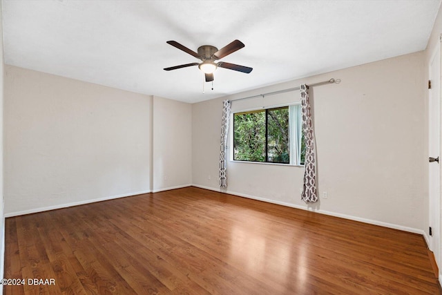 spare room featuring ceiling fan and wood-type flooring