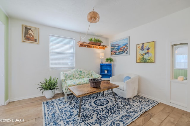 sitting room featuring light hardwood / wood-style floors