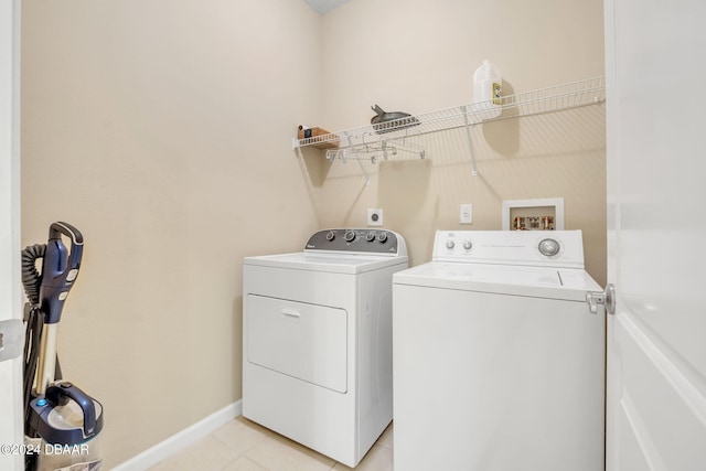 laundry room featuring separate washer and dryer