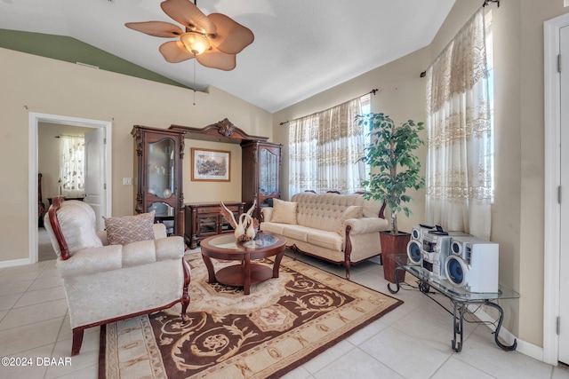 tiled living room with ceiling fan and lofted ceiling